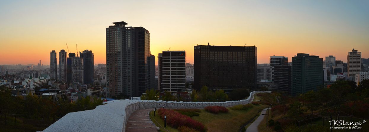 Sunset at the lower parts Namsan Park. In the front is a renovated part of the city's defence wall. 