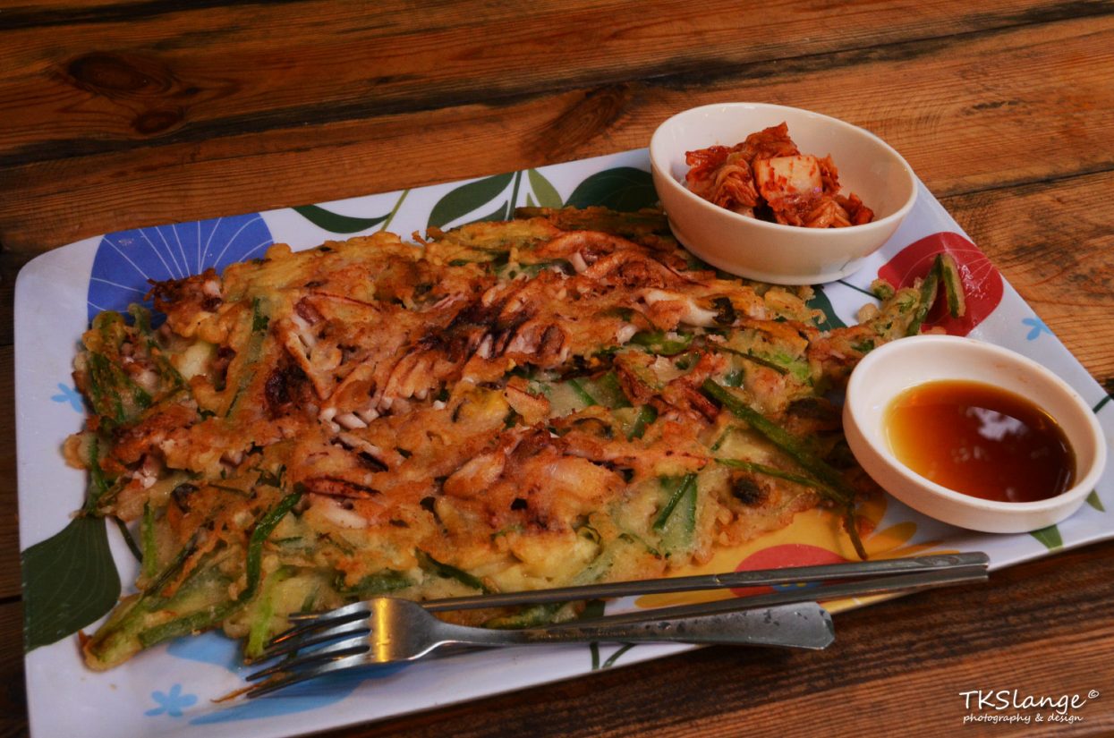 Haemul pajeon, a Korean style pancake with green unions and squid.