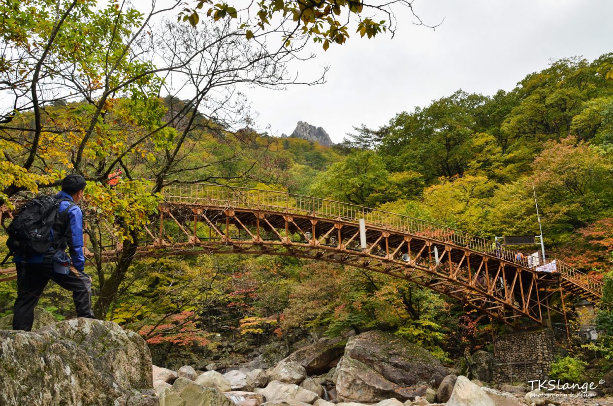 A rusty bridge at the Biseondae rocks.
